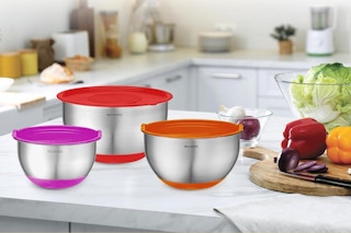 a set of mixing bowls near groceries