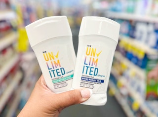 hand holding two Degree Unlimited deodorants