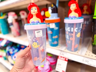 hand holding zak designs kids character little mermaid tumbler near target shelf