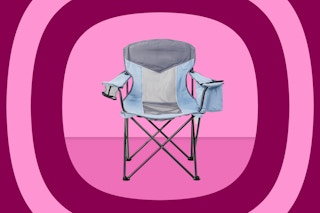 blue and gray camping chair on pink background