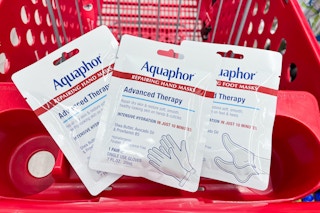 3 pairs of aquaphor masks sitting on top of a target cart