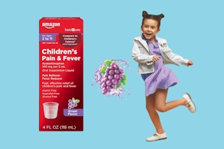 A giant box of Amazon Basic Care Children's Acetaminophen, grape flavor, a bunch of grapes, a happy child.