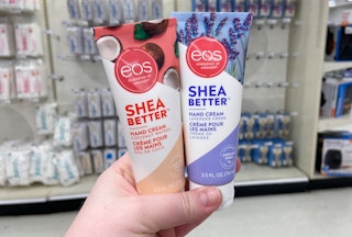 hand holding eos shea better hand cream
