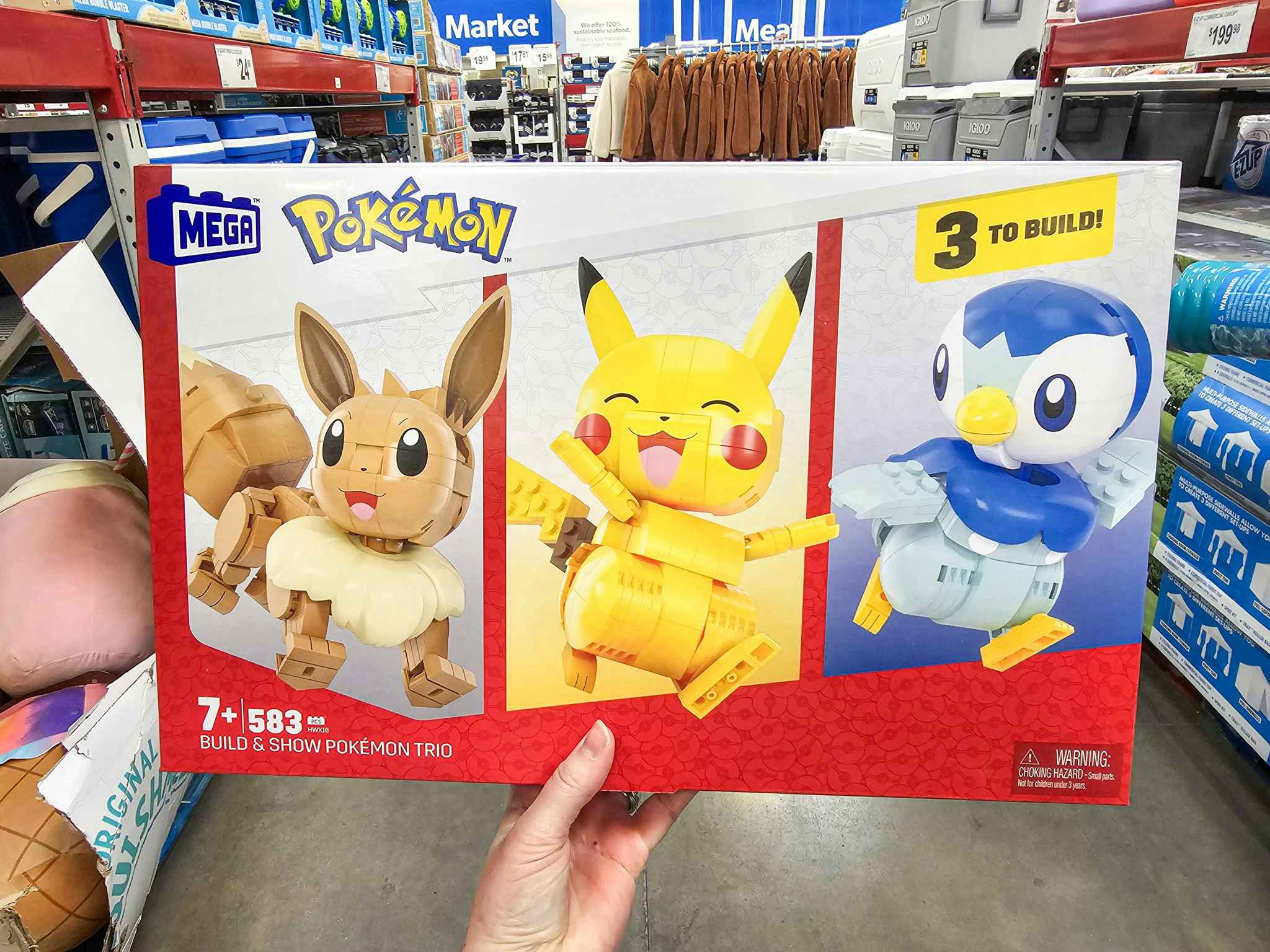 person holding a pokemon mega construx trio
