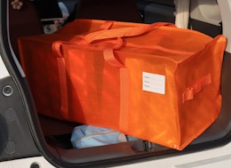 an orange bag in the backseat of a car