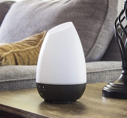 White diffuser on a table in a room