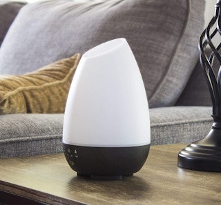 White diffuser on a table in a room