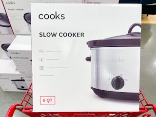 A Cooks Slow Cooker sitting in a store shopping cart