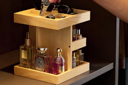 a man putting a watch in an organizer