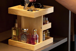 a man putting a watch in an organizer