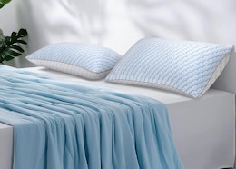two pillows on a bed