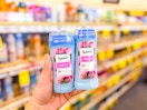 person holding 2 suave deodorants