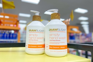 two bottles of raw sugar hand wash on store counter