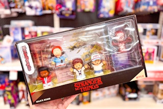 hand holding a little people stranger things set at target