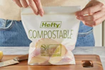 woman zipping up apples in Hefty compostable sandwich bags