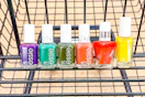 essie nail polish lined up in shopping cart
