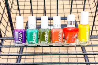 essie nail polish lined up in shopping cart