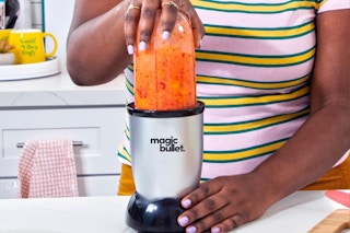 Magic Bullet Blender, Small, Silver, 11 Piece Set on a counter top.