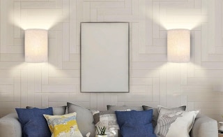 Scones on a wall above a grey couch