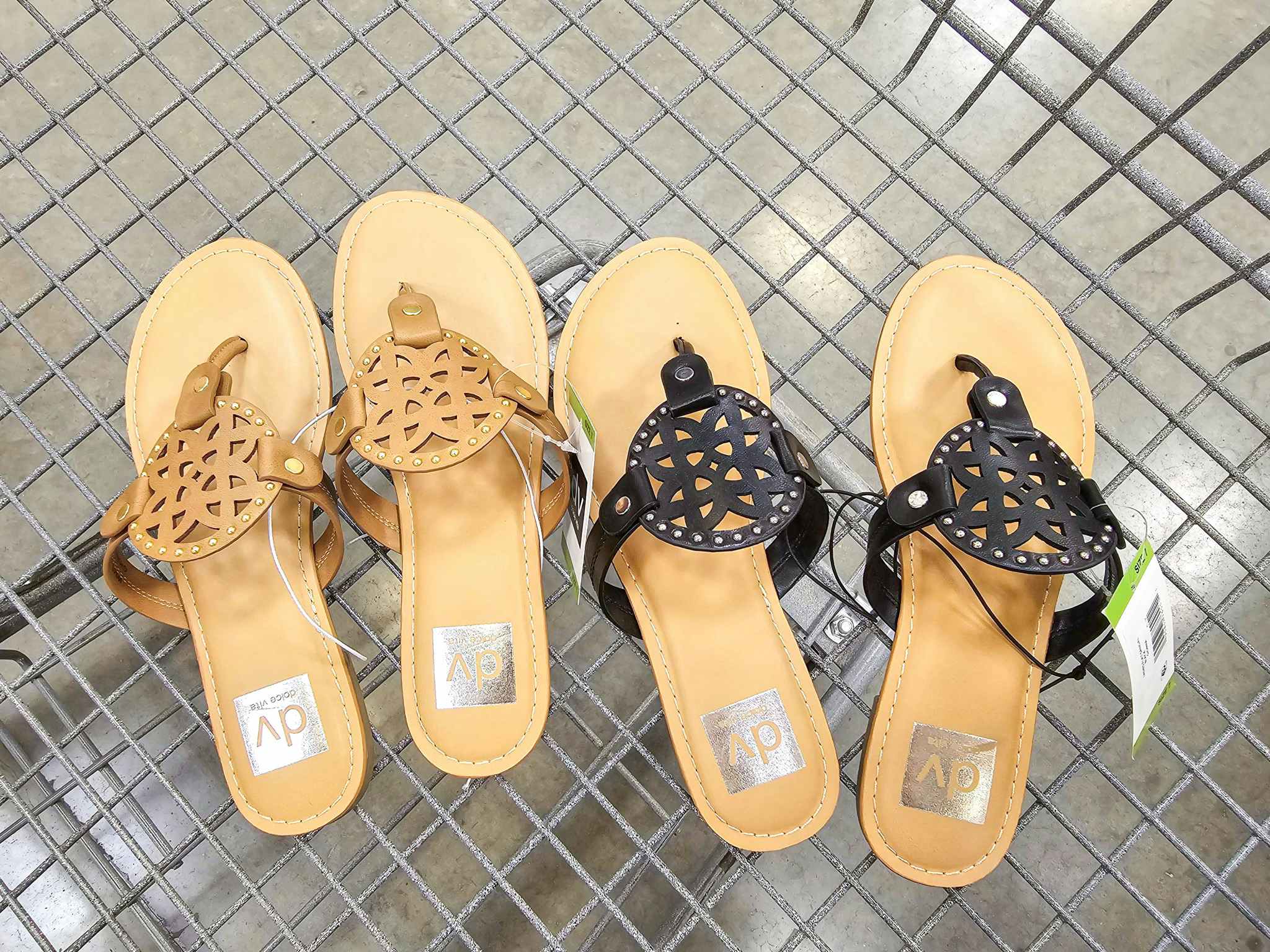 2 pairs of sandals in a cart