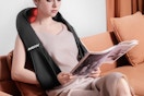 a woman wearing a neck massager