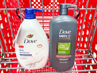 A Dove Deep Moisture bottle and Dove Men+Care sitting in a store cart.