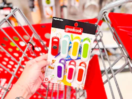 hand holding a pack of goodcook magnetic bag clips in front of a target cart