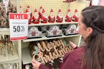 a person shopping 50 percent off christmas decor in hobby lobby