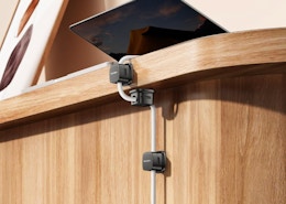 magnetic clips on a desk with a cord plugged into a device