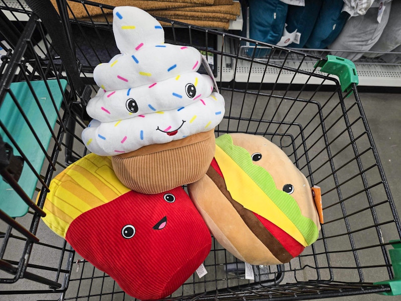 cupcake, french fries, and hamburger plushes in a cart