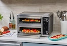 powerxl dual door air fryer oven sitting on a countertop 