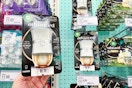 hand holding an air wick warmer in front of target shelf