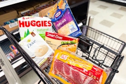 huggies, oscar mayer, kraft, smart ones and dove products in a black meijer shopping cart