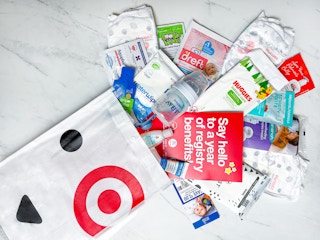 a target baby registry welcome bag with the contents layed out on a counter
