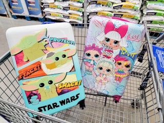 star wars and lol surprise luggage in a cart