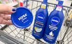 hand holding nivea body lotion next to two bottles of nivea lotion