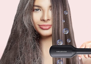 a person using a straightening hair brush on their hair