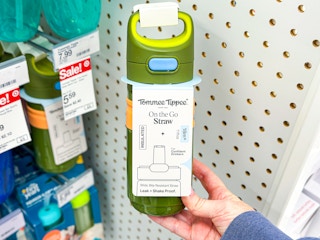 hand holding a tommee tippee straw bottle at target