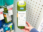 hand holding a tommee tippee straw bottle at target