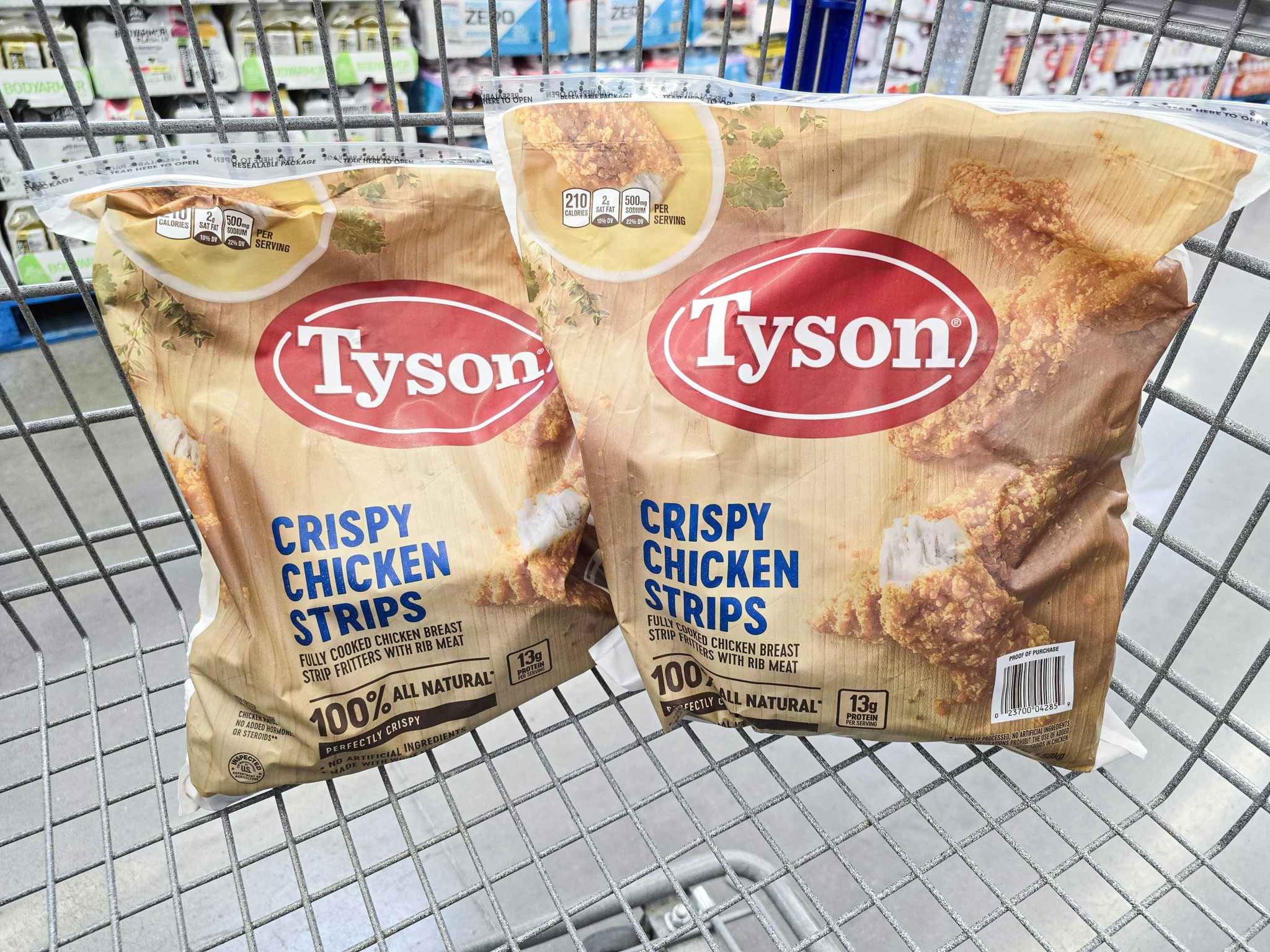2 huge bags of tyson chicken strips in a shopping cart