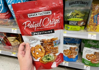 hand holding bag of pretzel crisps