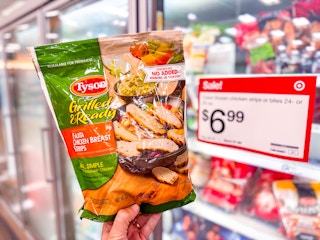 hand holding a bag of tyson fajita chicken strips at target