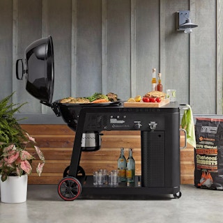 a grill set up with food on it cooking