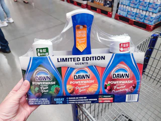 hand holding dawn dishspray set on cart