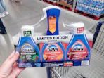 hand holding dawn dishspray set on cart