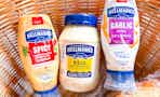 Hellman's mayonnaise, spicy mayo, and garlic aoili sauce in a brown basket