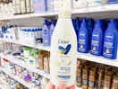 hand holding dove body love lotion in lotion aisle at store