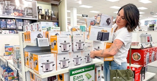 person in kohls store holding several boxes of toastmaster small appliance