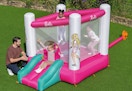 children jumping on an inflatable Barbie bounce house
