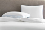 Lifestyle image of the Serta Pillow 2-pack in bed